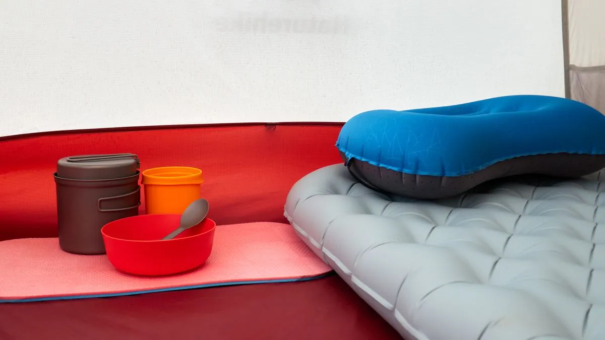 Sleeping pad and camping equipment arranged inside a tent